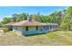 View of a charming home featuring a screen-enclosed pool and private backyard at 15107 3Rd E Dr, Bradenton, FL 34212