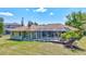 Expansive backyard features a screened pool and lush landscaping, ideal for relaxing or entertaining at 15107 3Rd E Dr, Bradenton, FL 34212