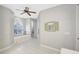 Bright and spacious bathroom featuring a large soaking tub, tile floors, and a decorative window at 15107 3Rd E Dr, Bradenton, FL 34212