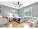 Charming bedroom with stylish decor, hardwood floors, and a ceiling fan for added comfort at 15107 3Rd E Dr, Bradenton, FL 34212
