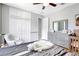 Cozy bedroom features neutral walls, a ceiling fan, and dresser storage at 15107 3Rd E Dr, Bradenton, FL 34212