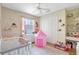 Delightful room with a crib, a tent, a window, a closet, and fun decor at 15107 3Rd E Dr, Bradenton, FL 34212