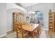 Dining room with large arched window and chandelier, a great space for entertaining guests at 15107 3Rd E Dr, Bradenton, FL 34212