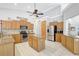 Well-lit kitchen with granite countertops, stainless steel appliances, and plenty of cabinet storage for easy organization at 15107 3Rd E Dr, Bradenton, FL 34212