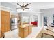 Open concept kitchen with wooden cabinets, granite countertops, and stainless steel appliances at 15107 3Rd E Dr, Bradenton, FL 34212