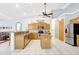 Bright kitchen features wooden cabinets, granite countertops, stainless steel appliances, and tile floors at 15107 3Rd E Dr, Bradenton, FL 34212