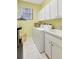Efficient laundry room with appliances, cabinets, and a practical sink at 15107 3Rd E Dr, Bradenton, FL 34212
