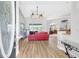 Inviting living room with hardwood floors, stylish decor, and bright natural light, creating a warm ambiance at 15107 3Rd E Dr, Bradenton, FL 34212