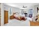 Bright main bedroom with large windows, soft carpet, and access to a private outdoor area at 15107 3Rd E Dr, Bradenton, FL 34212