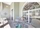 Cozy front patio seating area with comfortable chairs, side table, stylish accents, and natural light at 15107 3Rd E Dr, Bradenton, FL 34212