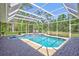 Refreshing screened-in pool with tiled accents and clear blue water, perfect for relaxation at 15107 3Rd E Dr, Bradenton, FL 34212