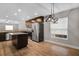 Modern kitchen with stainless steel appliances, granite countertops, recessed lighting, and center island at 1602 E Mulberry Dr, Tampa, FL 33604