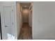Hallway featuring tile flooring, neutral paint, and multiple doors at 16120 Ivy Ridge Ct, Port Charlotte, FL 33953