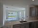 The home includes a modern kitchen that features quartz countertops and stainless steel appliances at 16120 Ivy Ridge Ct, Port Charlotte, FL 33953