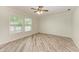 Bedroom with natural light from two windows and stylish wood-look flooring at 2601 13Th W St, Palmetto, FL 34221