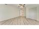 Bright bedroom with wood-look flooring, ceiling fan and closet at 2601 13Th W St, Palmetto, FL 34221