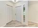 Inviting entryway featuring a large front door, tile floors, and a coat closet at 2601 13Th W St, Palmetto, FL 34221