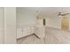 Bright kitchen features white cabinets, modern countertops, and flows into a living area at 2601 13Th W St, Palmetto, FL 34221