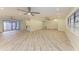 Bright living room with lots of space and a neutral color scheme, ceiling fans, and recessed lighting at 2601 13Th W St, Palmetto, FL 34221