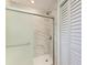 Beautifully tiled walk-in shower with glass door and a large shower head at 2601 13Th W St, Palmetto, FL 34221
