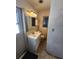 Modest bathroom with a small window and a sink vanity at 2727 Waldemere St, Sarasota, FL 34239