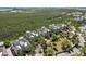 Aerial view of community homes surrounded by lush greenery, offering privacy and beautiful landscape views at 275 Sapphire Lake Dr # 101, Bradenton, FL 34209