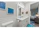 Stylish bathroom featuring a double sink vanity, starfish decor, coastal artwork, and tiled floors at 275 Sapphire Lake Dr # 101, Bradenton, FL 34209