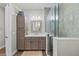 Modern bathroom featuring a glass-enclosed shower, vanity sink, and plenty of storage space with modern fixtures at 275 Sapphire Lake Dr # 101, Bradenton, FL 34209