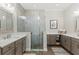 Elegant bathroom with a glass-enclosed shower, double vanity sinks, and plenty of storage space, complemented by modern finishes at 275 Sapphire Lake Dr # 101, Bradenton, FL 34209