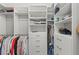 Spacious walk-in closet with custom shelving and ample storage for clothing and accessories at 275 Sapphire Lake Dr # 101, Bradenton, FL 34209