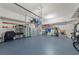 Spacious three car garage with epoxy floor, overhead storage, storage shelves, and room for parking at 275 Sapphire Lake Dr # 101, Bradenton, FL 34209