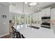 A bright and airy kitchen featuring a large island with seating, quartz countertops at 275 Sapphire Lake Dr # 101, Bradenton, FL 34209