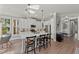A bright and airy kitchen with white cabinets, quartz countertops, and bar stool seating at 275 Sapphire Lake Dr # 101, Bradenton, FL 34209