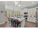 Bright kitchen featuring white cabinetry, quartz countertops, and stainless steel appliances at 275 Sapphire Lake Dr # 101, Bradenton, FL 34209