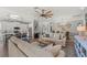 Spacious open-concept living room flowing into the kitchen and dining area at 275 Sapphire Lake Dr # 101, Bradenton, FL 34209