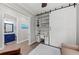 Bright office area with a built-in desk, shelving, and a sliding barn door for privacy at 275 Sapphire Lake Dr # 101, Bradenton, FL 34209