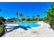 Inviting community pool surrounded by lush landscaping and comfortable lounge chairs at 275 Sapphire Lake Dr # 101, Bradenton, FL 34209
