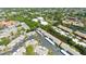 Aerial view of the community, showing well-maintained buildings, parking, and nearby waterways and greenery at 2839 Swifton Dr # 28, Sarasota, FL 34231