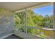 Screened balcony offering a tranquil view of lush trees and a serene river at 2839 Swifton Dr # 28, Sarasota, FL 34231