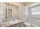 Bathroom featuring a long marble countertop, a toilet and a shower/tub combo at 2839 Swifton Dr # 28, Sarasota, FL 34231