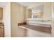 A compact desk area features a mirror and built in shelves offering a convenient workspace at 2839 Swifton Dr # 28, Sarasota, FL 34231