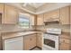 Kitchen with matching appliances and a window at 2839 Swifton Dr # 28, Sarasota, FL 34231