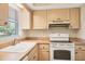 Kitchen with matching appliances and a window at 2839 Swifton Dr # 28, Sarasota, FL 34231