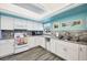 Bright kitchen featuring white cabinets, granite countertops, stainless steel appliances, and a cozy breakfast nook at 2839 Swifton Dr # 28, Sarasota, FL 34231