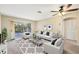 Comfortable living room featuring a ceiling fan, balcony access, and a relaxing atmosphere at 2839 Swifton Dr # 28, Sarasota, FL 34231