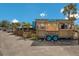 Colorful tiki bar on wheels is set up with festive decorations, including a cartoon crab at 2839 Swifton Dr # 28, Sarasota, FL 34231