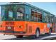 Orange and Green trolley bus for touring the area of Siesta Key at 2839 Swifton Dr # 28, Sarasota, FL 34231