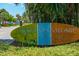 A decorative sign welcomes visitors to Siesta Key Village, surrounded by lush greenery and palm trees at 2839 Swifton Dr # 28, Sarasota, FL 34231