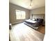 Large bedroom with a ceiling fan and large windows at 2918 Butterfly Jasmine Trl, Sarasota, FL 34240