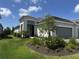 Charming single-story home with well-manicured lawn and flower beds at 2918 Butterfly Jasmine Trl, Sarasota, FL 34240